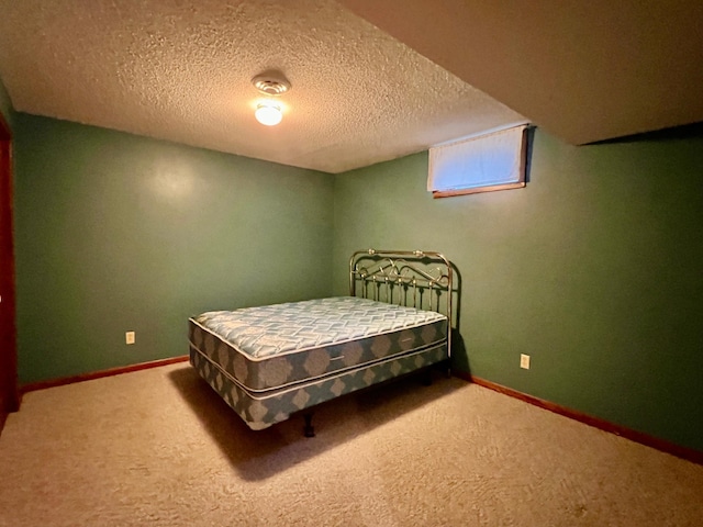 1002 6th Ave N, Wheaton, MN 56296 - carpeted bedroom featuring a textured ceiling and baseboards