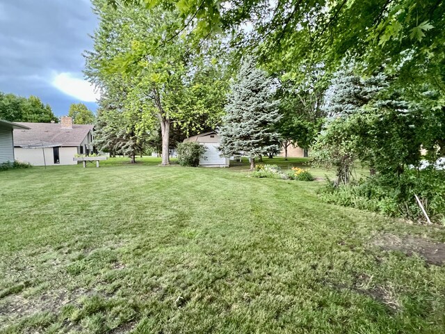 1002 6th Ave N, Wheaton, MN 56296 - view of green lawn with a storage unit