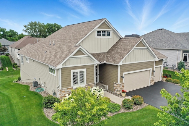 4364 Ginger Dr, Minnetrista, MN 55331 - craftsman inspired home with board and batten siding, stone siding, a garage, and a front yard