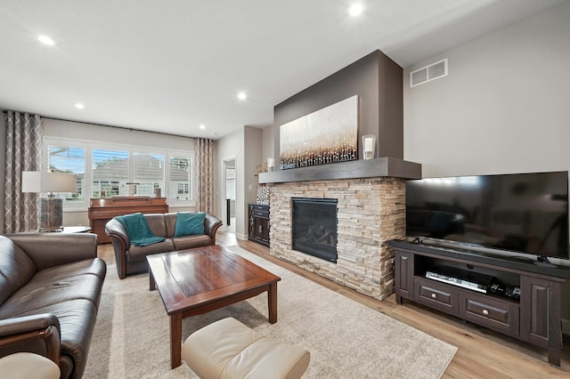 4364 Ginger Dr, Minnetrista, MN 55331 - living area featuring light wood-type flooring, a fireplace, and recessed lighting