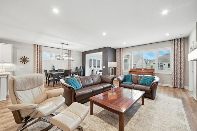 4364 Ginger Dr, Minnetrista, MN 55331 - living room featuring light wood-style floors, recessed lighting, and a chandelier