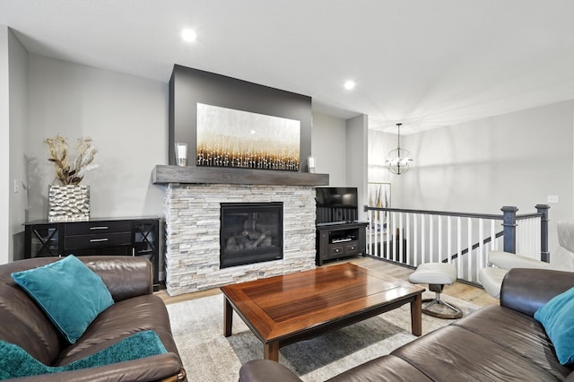 4364 Ginger Dr, Minnetrista, MN 55331 - living room with wood finished floors, a chandelier, a fireplace, and recessed lighting