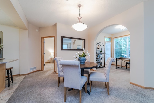 625 Wesley Commons Dr Unit 36, Golden Valley, MN 55427 - dining space with arched walkways and light colored carpet