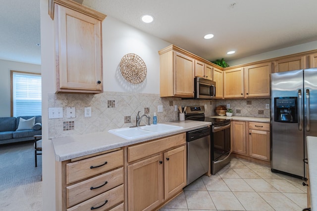 625 Wesley Commons Dr Unit 36, Golden Valley, MN 55427 - kitchen with appliances with stainless steel finishes, light brown cabinets, light countertops, tasteful backsplash, and recessed lighting