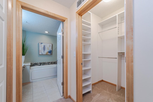 625 Wesley Commons Dr Unit 36, Golden Valley, MN 55427 - walk in closet with tile patterned floors and carpet