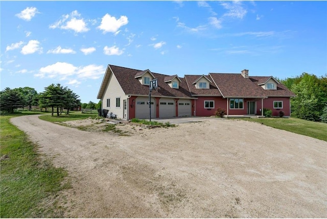 2832 130th Ave, Glenwood City, WI 54013 - view of front of house featuring driveway, an attached garage, and a chimney