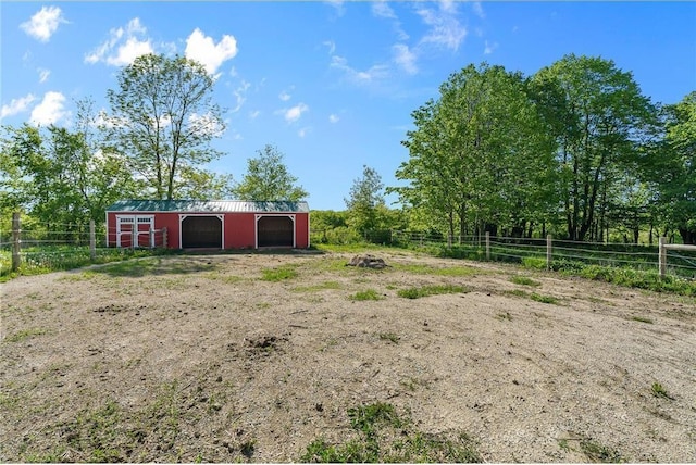 2832 130th Ave, Glenwood City, WI 54013 - view of yard featuring an outbuilding, a garage, an outdoor structure, a rural view, and dirt driveway