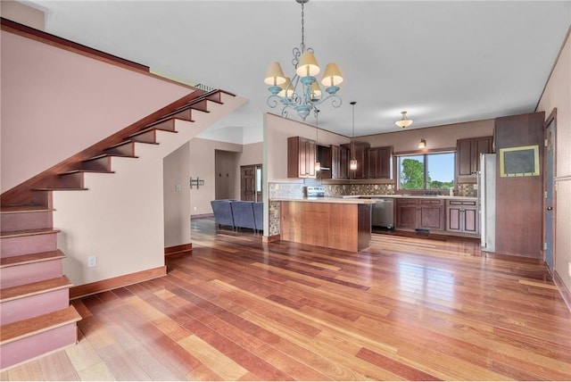 2832 130th Ave, Glenwood City, WI 54013 - kitchen with dishwasher, open floor plan, light countertops, high end refrigerator, and backsplash