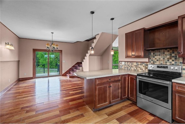 2832 130th Ave, Glenwood City, WI 54013 - kitchen with electric stove, healthy amount of natural light, light countertops, and backsplash