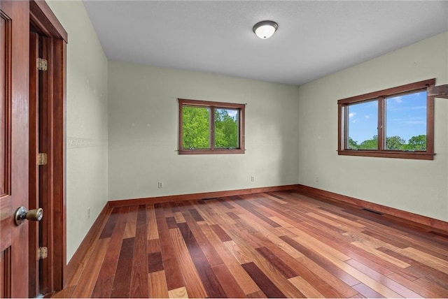 2832 130th Ave, Glenwood City, WI 54013 - unfurnished room with plenty of natural light and wood finished floors