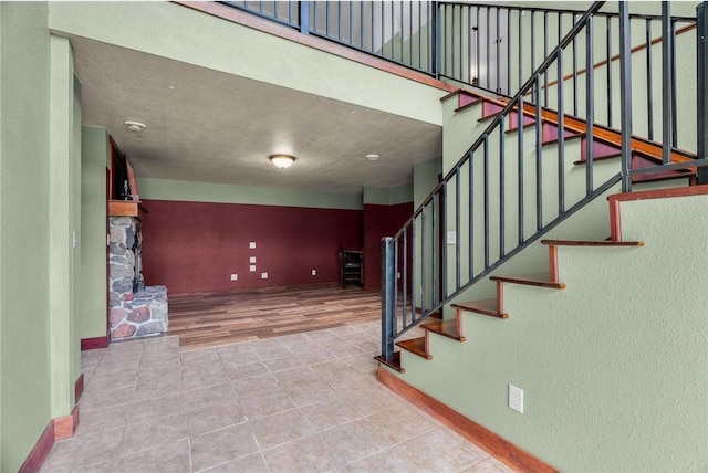 2832 130th Ave, Glenwood City, WI 54013 - staircase featuring baseboards and tile patterned floors