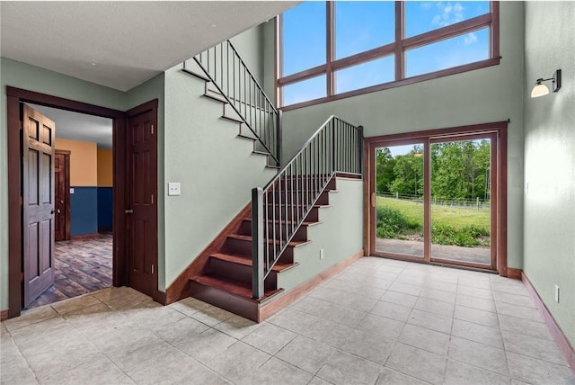 2832 130th Ave, Glenwood City, WI 54013 - stairway featuring tile patterned floors and a high ceiling