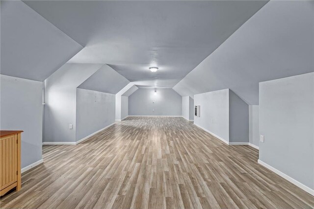 2832 130th Ave, Glenwood City, WI 54013 - additional living space with light wood-style flooring and vaulted ceiling
