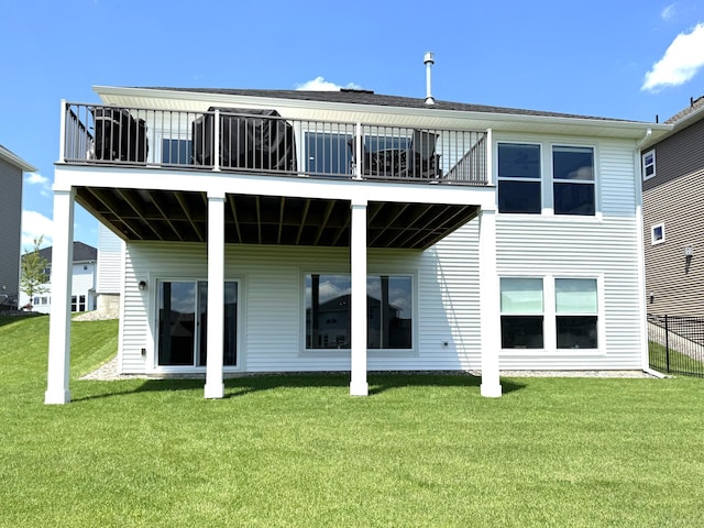 15613 116th Ave N, Dayton, MN 55369 - back of house featuring a balcony and a lawn