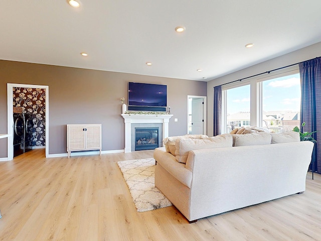 15613 116th Ave N, Dayton, MN 55369 - living area featuring light wood-type flooring, a tile fireplace, and recessed lighting