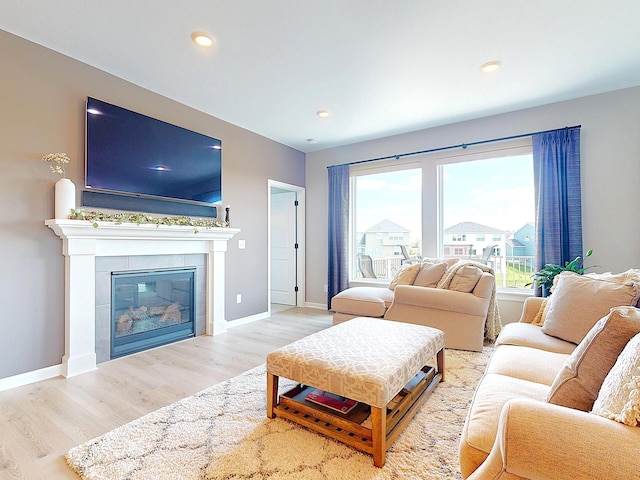15613 116th Ave N, Dayton, MN 55369 - living room with wood finished floors, a glass covered fireplace, and recessed lighting