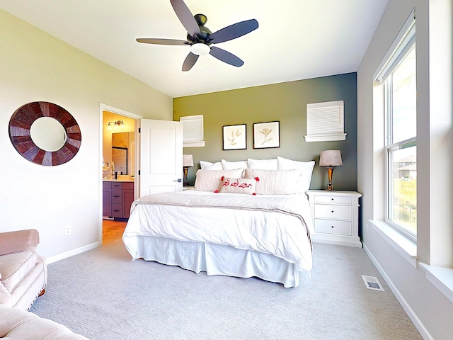 15613 116th Ave N, Dayton, MN 55369 - carpeted bedroom with ensuite bathroom and a ceiling fan