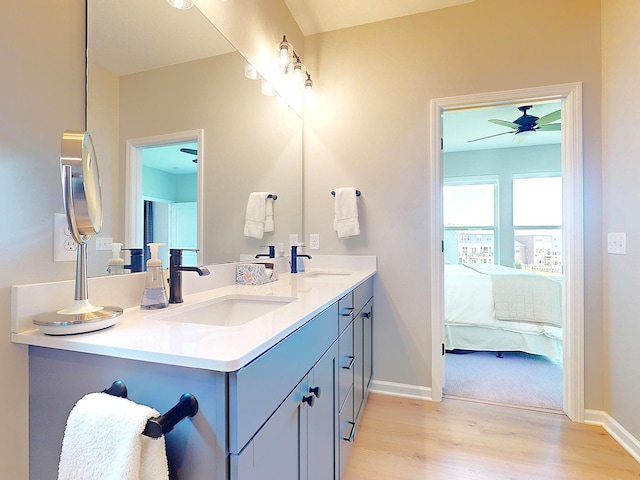15613 116th Ave N, Dayton, MN 55369 - ensuite bathroom with double vanity, wood finished floors, and a ceiling fan