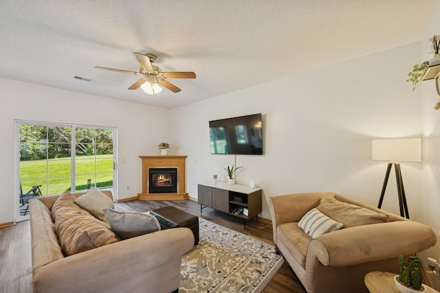 2840 Brewers Ln, Stillwater, MN 55082 - living room with ceiling fan, wood finished floors, and a glass covered fireplace