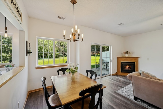 2840 Brewers Ln, Stillwater, MN 55082 - dining space with healthy amount of natural light, dark wood finished floors, and a chandelier