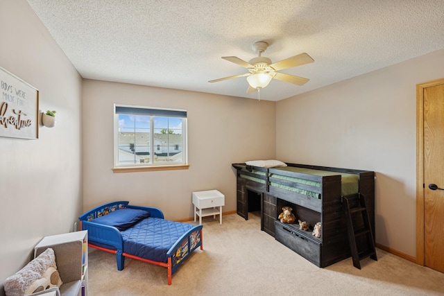 2840 Brewers Ln, Stillwater, MN 55082 - bedroom with carpet flooring, a fireplace, a textured ceiling, and ceiling fan