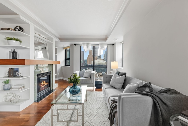100 3rd Ave S Unit 805, Minneapolis, MN 55401 - living room featuring ornamental molding, dark wood-style floors, a fireplace, and built in features