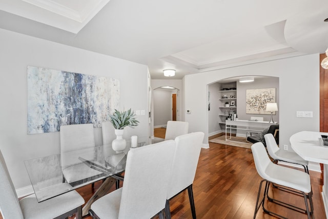 100 3rd Ave S Unit 805, Minneapolis, MN 55401 - dining area with arched walkways, a tray ceiling, wood finished floors, and crown molding