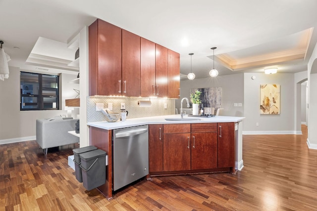 100 3rd Ave S Unit 805, Minneapolis, MN 55401 - kitchen with a raised ceiling, dishwasher, dark wood-type flooring, a peninsula, and ornamental molding