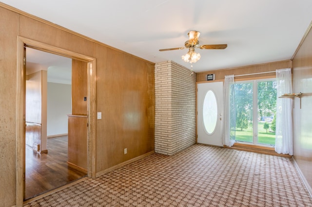2808 34th Ave NE, Saint Anthony, MN 55418 - entrance foyer with ceiling fan and wooden walls