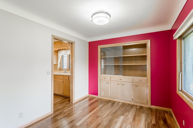 2808 34th Ave NE, Saint Anthony, MN 55418 - unfurnished dining area featuring light wood finished floors and healthy amount of natural light
