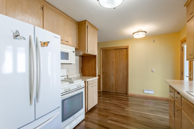 2808 34th Ave NE, Saint Anthony, MN 55418 - kitchen with white appliances, light countertops, dark wood-style floors, and tasteful backsplash