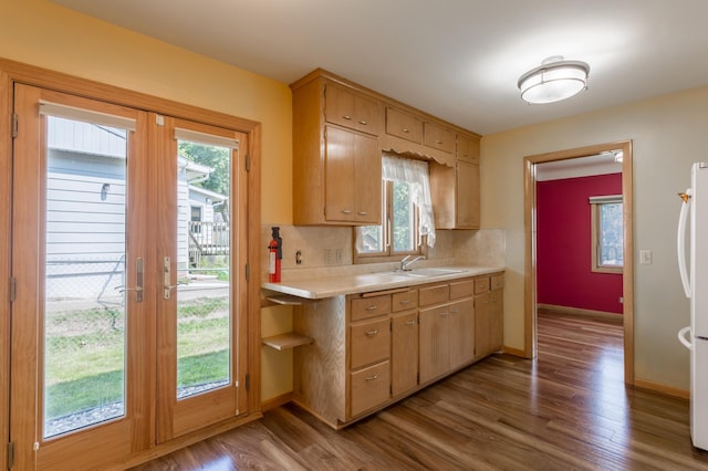 2808 34th Ave NE, Saint Anthony, MN 55418 - kitchen with french doors, light countertops, wood finished floors, and freestanding refrigerator