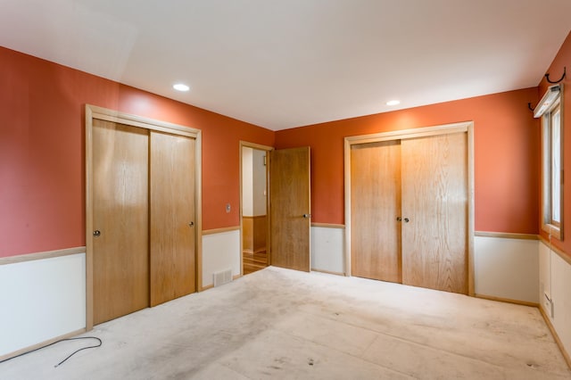 2808 34th Ave NE, Saint Anthony, MN 55418 - unfurnished bedroom with carpet floors, two closets, and recessed lighting