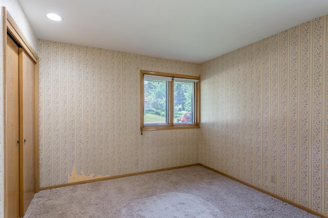 2808 34th Ave NE, Saint Anthony, MN 55418 - unfurnished bedroom with a closet, carpet flooring, and recessed lighting