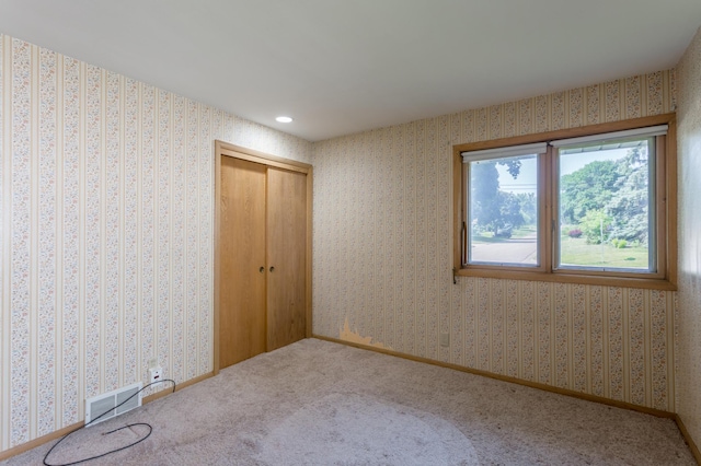 2808 34th Ave NE, Saint Anthony, MN 55418 - unfurnished bedroom with a closet, carpet floors, and recessed lighting