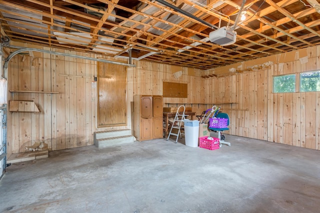 2808 34th Ave NE, Saint Anthony, MN 55418 - garage with a garage door opener and wooden walls