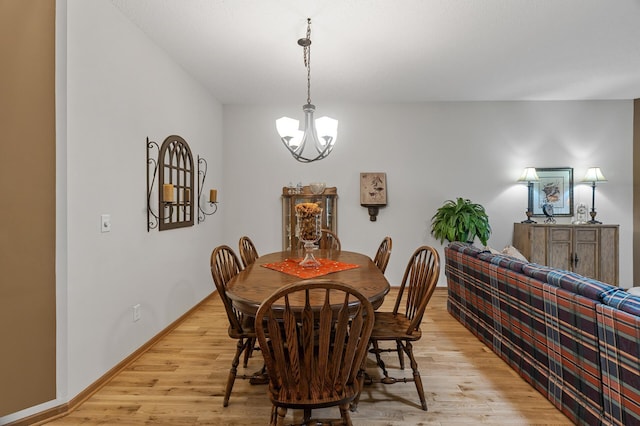 6511 98th Ln N, Brooklyn Park, MN 55445 - dining area featuring a chandelier and light wood-type flooring
