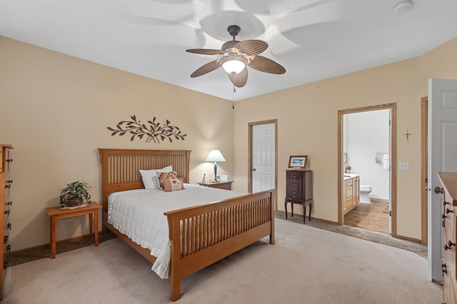 6511 98th Ln N, Brooklyn Park, MN 55445 - bedroom featuring light carpet, ensuite bath, and ceiling fan