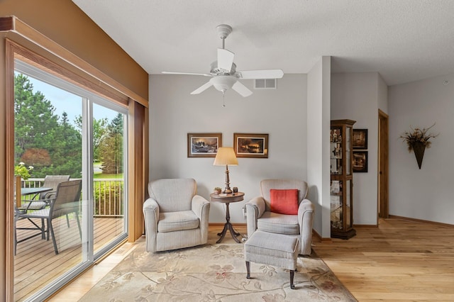6511 98th Ln N, Brooklyn Park, MN 55445 - living area with light wood-type flooring and a ceiling fan
