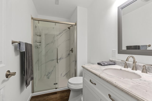 6511 98th Ln N, Brooklyn Park, MN 55445 - full bathroom with vanity, a marble finish shower, and wood finished floors