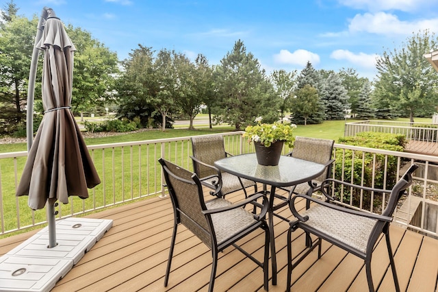 6511 98th Ln N, Brooklyn Park, MN 55445 - wooden deck featuring a lawn and view of scattered trees