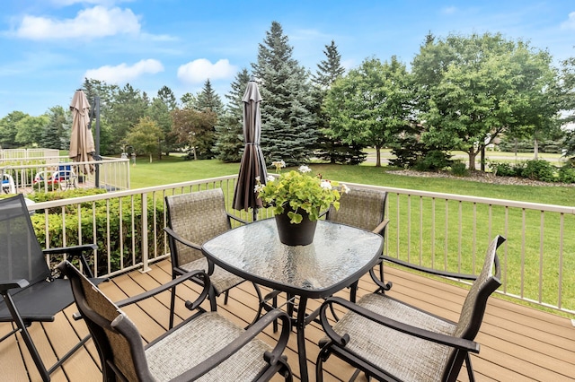 6511 98th Ln N, Brooklyn Park, MN 55445 - wooden terrace featuring a yard, view of scattered trees, and outdoor dining space