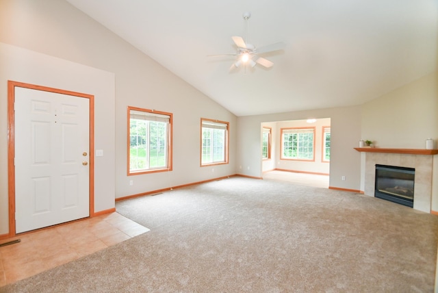 11812 37th St NE, Saint Michael, MN 55376 - unfurnished living room with carpet floors, lofted ceiling, plenty of natural light, a ceiling fan, and a fireplace
