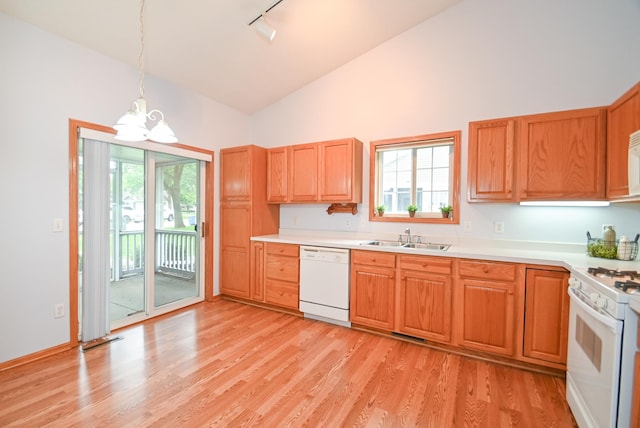 11812 37th St NE, Saint Michael, MN 55376 - kitchen with white appliances, a chandelier, track lighting, high vaulted ceiling, and plenty of natural light