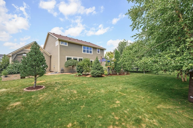 16615 54th Ave N, Plymouth, MN 55446 - rear view of property with a yard