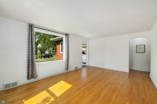 1636 2nd Ave S, Fargo, ND 58103 - empty room featuring hardwood / wood-style flooring and arched walkways