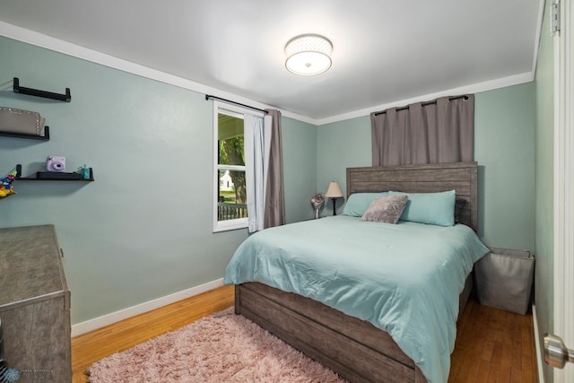 1636 2nd Ave S, Fargo, ND 58103 - bedroom featuring wood finished floors and ornamental molding