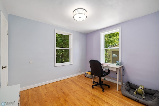1636 2nd Ave S, Fargo, ND 58103 - home office featuring healthy amount of natural light and light wood-style flooring
