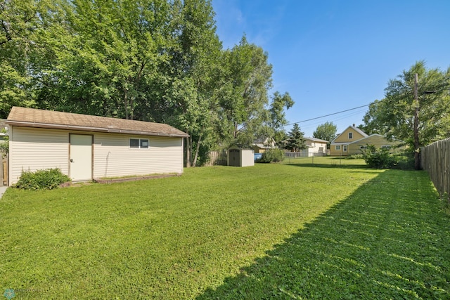 1636 2nd Ave S, Fargo, ND 58103 - fenced backyard with a storage unit