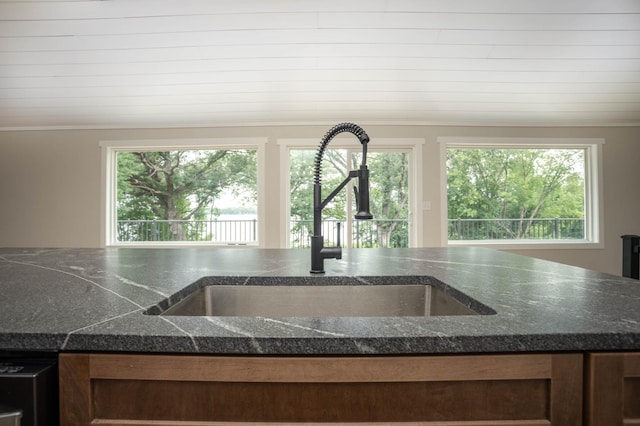 7591 Lake Ida Way NW, Alexandria, MN 56308 - kitchen view of ornamental molding and dark stone countertops